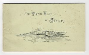 Paper cover booklet with waterfront, sailing boats and monument on hill.